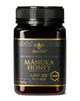 A jar of BeeNZ Premium New Zealand Mānuka Honey UMF 20+ in a 500g size, with a black and gold label.