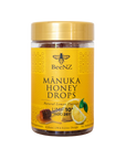 BeeNZ UMF 10+ Manuka Honey Drops with Lemon; a 24-count jar of individually wrapped lozenges showcasing the golden, natural texture of MGO 263+ honey.