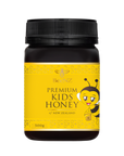 Jar of premium kids honey with a black lid and a bee on the front of the label indicating it is for kids.