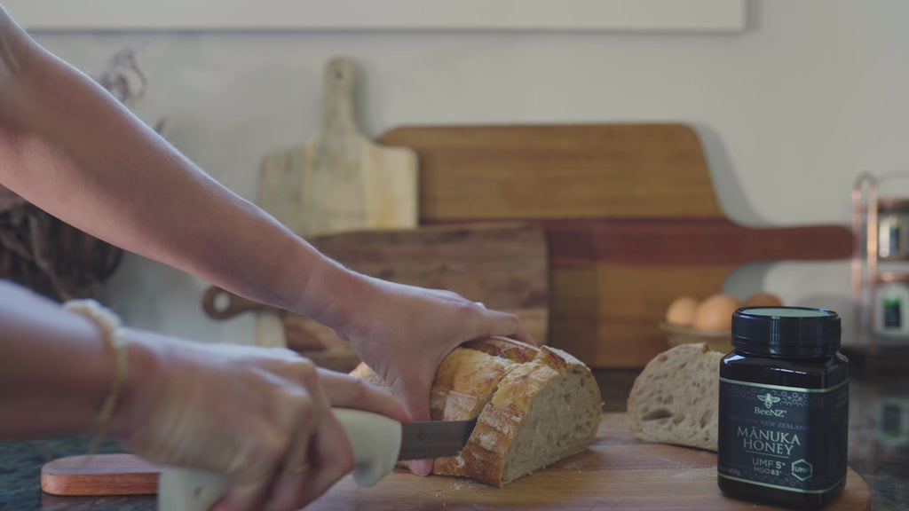Video of BeeNZ Manuka Honey UMF5+. Bread being sliced to spread honey on. This Manuka honey is best for everyday use. 